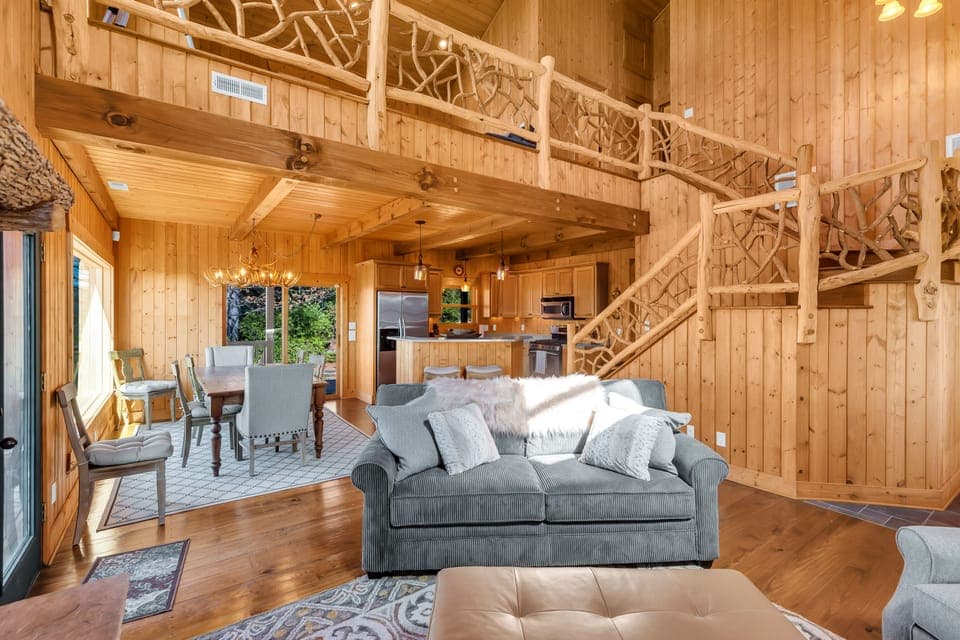 Main level with multiple doors leading to wraparound deck.