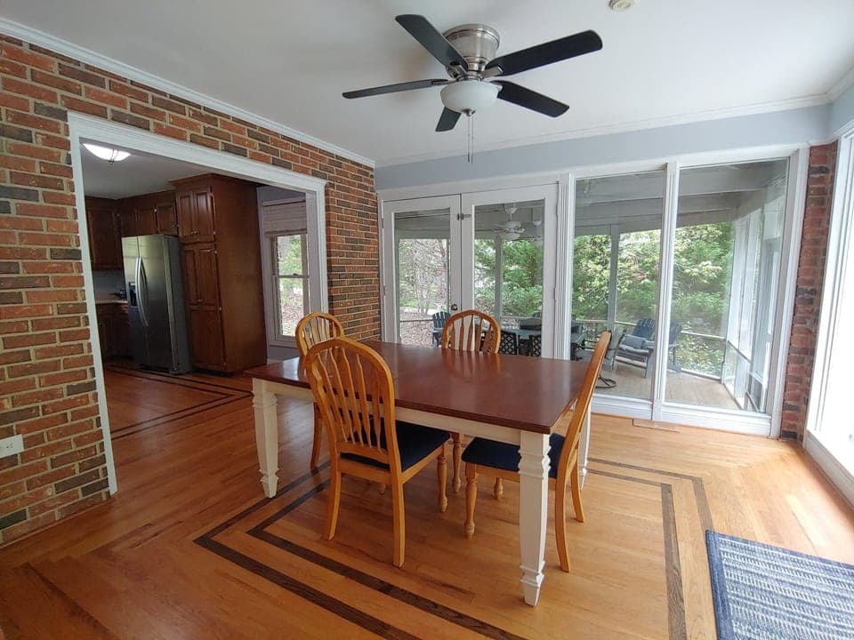 Kitchen nook and glass doors to deck (right) and screen porch (ahead). 