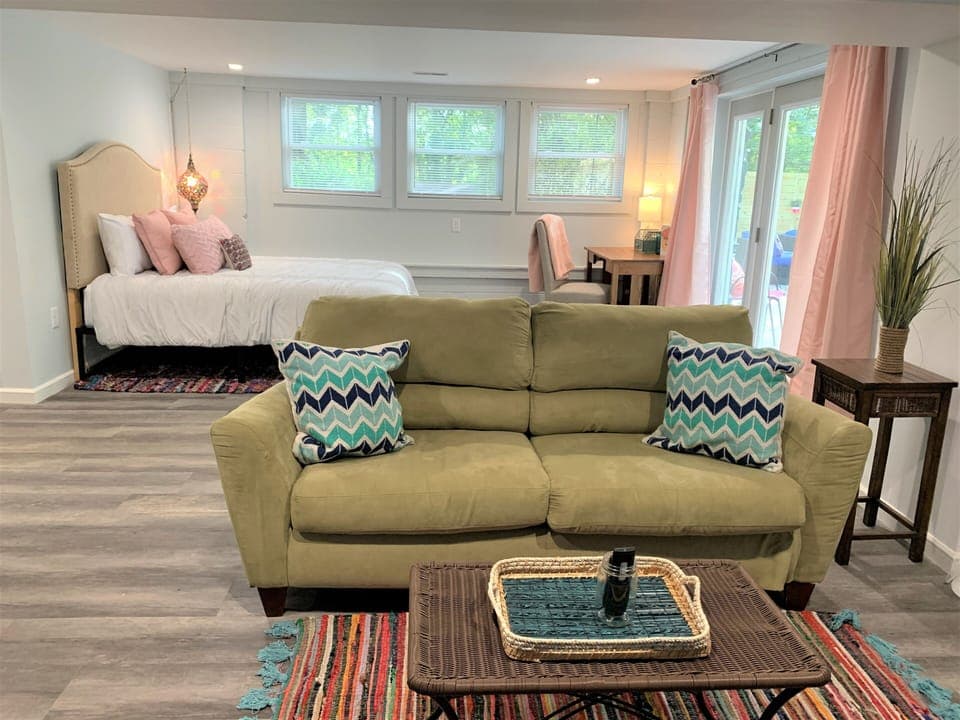 4th bedroom with queen bed and living area- located downstairs