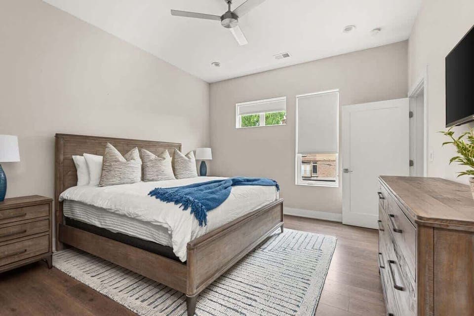 Guest bedroom w/ king bed with a beautiful window to look out to