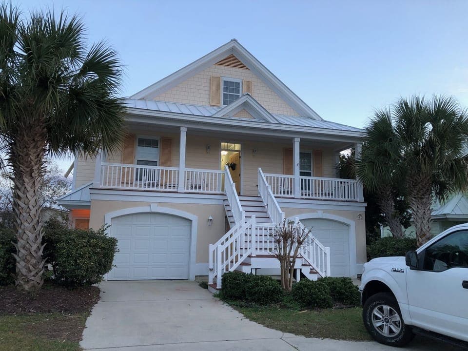 Front of house with parking for 5 vehicles