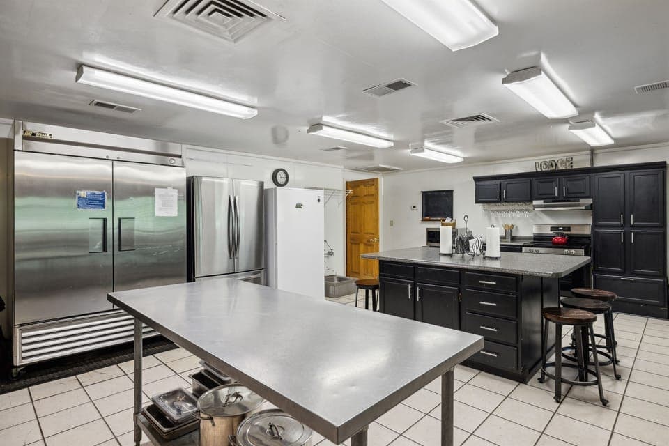 Huge kitchen! 3 fridges/freezers, 2 dishwashers, 2 gas and 1 electric stove.