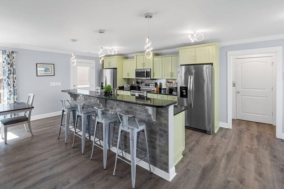 Cook up a feast in the fully equipped kitchen featuring stainless steel appliances. Dishwasher for easy clean up. 