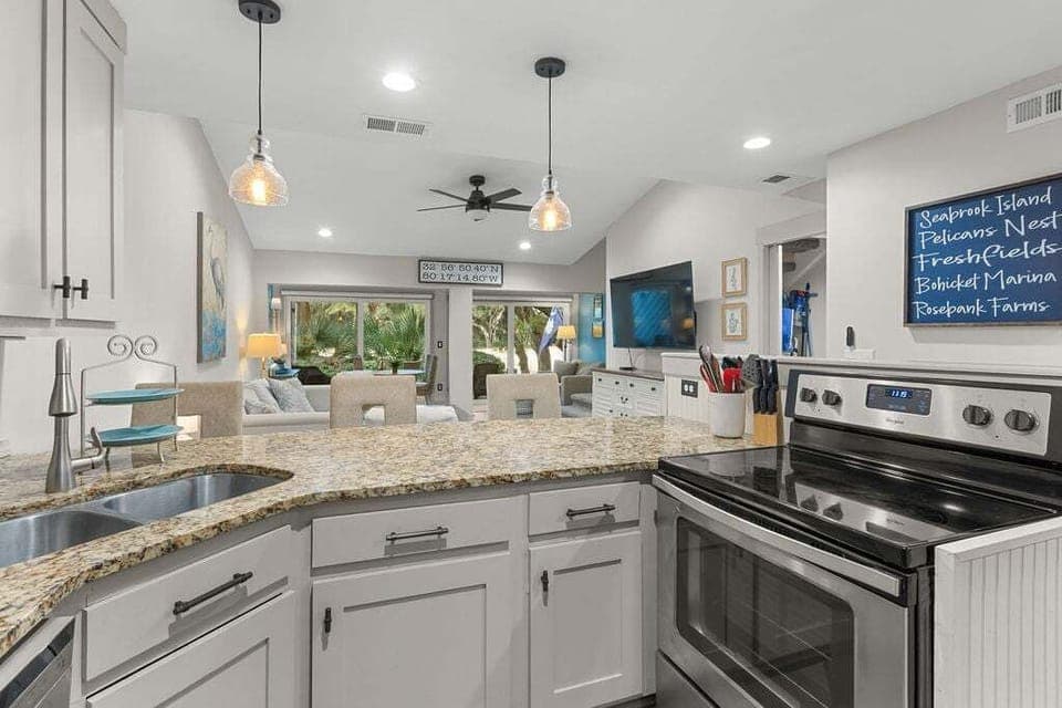 A breakfast bar with three cozy bar stools are available.