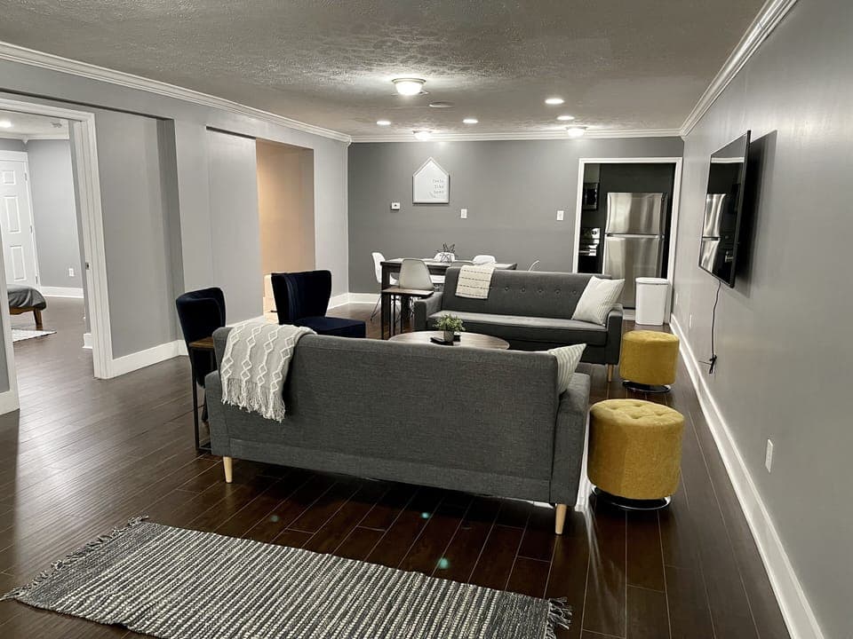 Living room and dining area. Plenty of seating around the 65 inch TV!