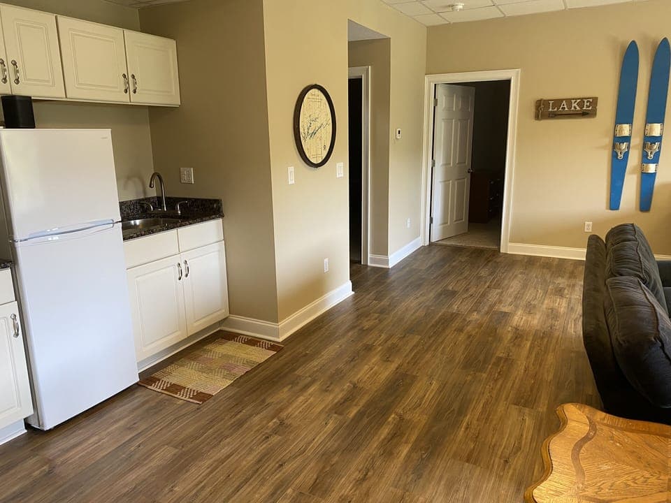 Lower level wet bar with refrigerator. 