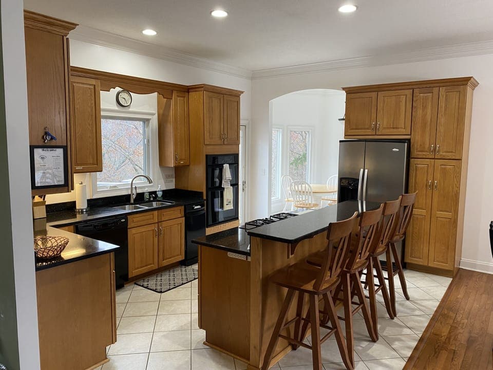 Kitchen island with seating facing lake. 