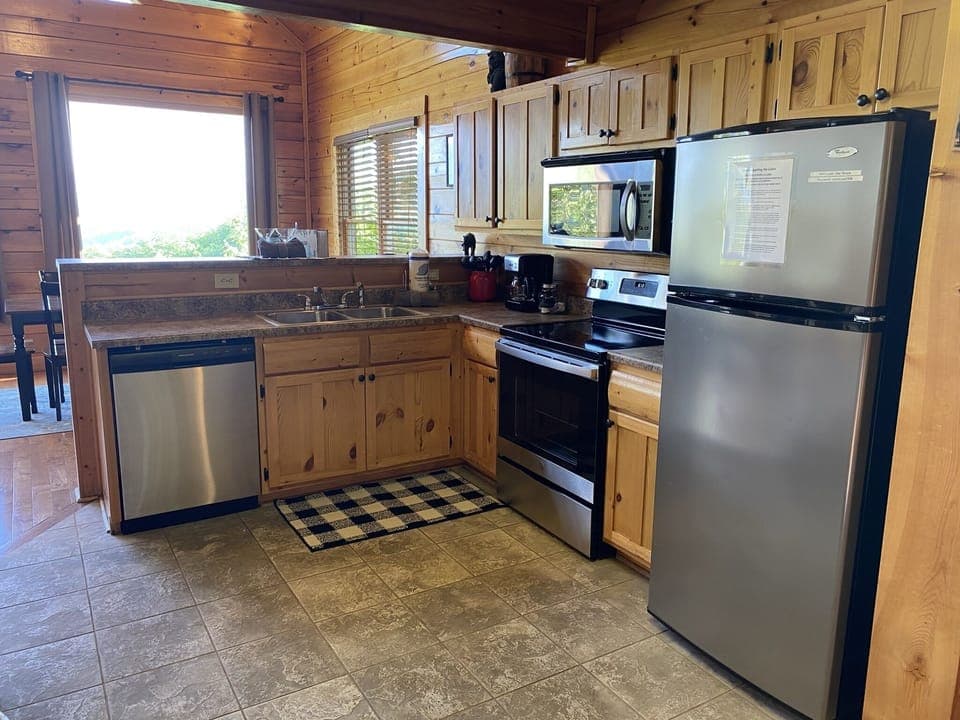 Modern kitchen open to the living area, with bar area for additional seating 