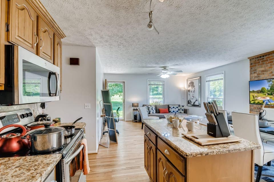 Cook, prepare, store, and serve food and drinks in the full size kitchen featuring many essentials.