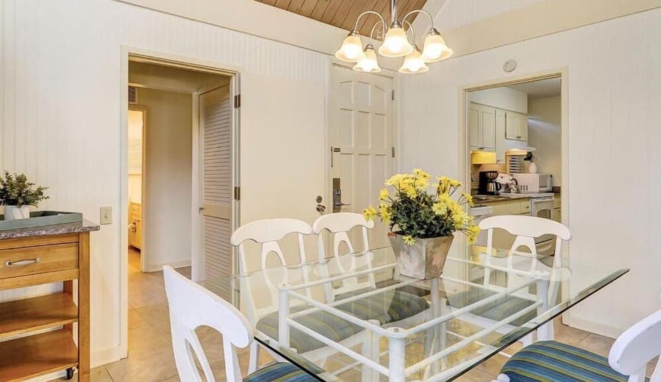 Gather for easy meals under warm lighting and airy ceilings.
