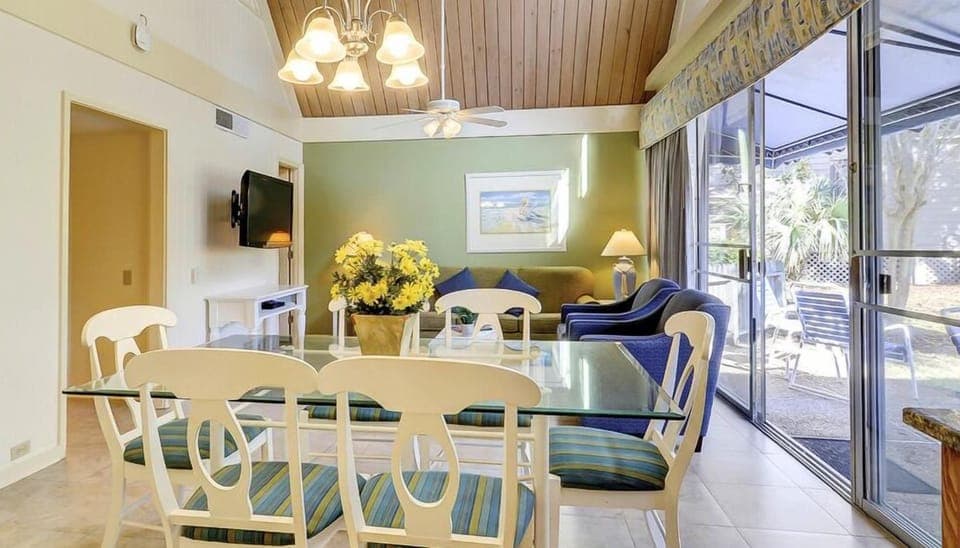 Unwind in the sunlit lounge steps from the screened patio.