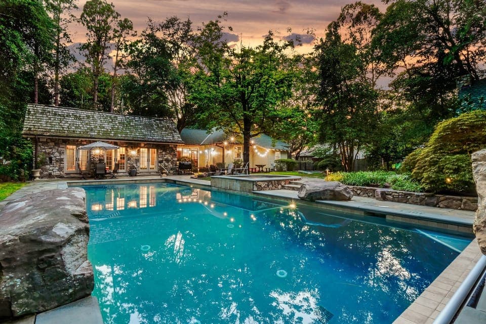 Nestled among lush landscaping, the stunning private pool is the perfect retreat for relaxation and fun.