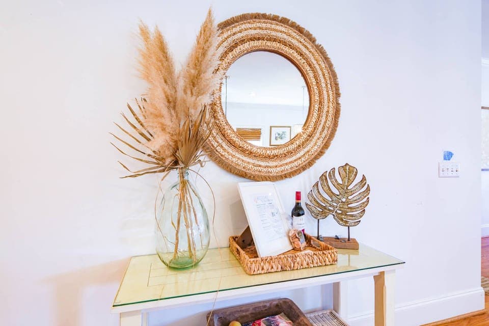 The two bedrooms on the first floor are located down the hall from the kitchen and dining area.