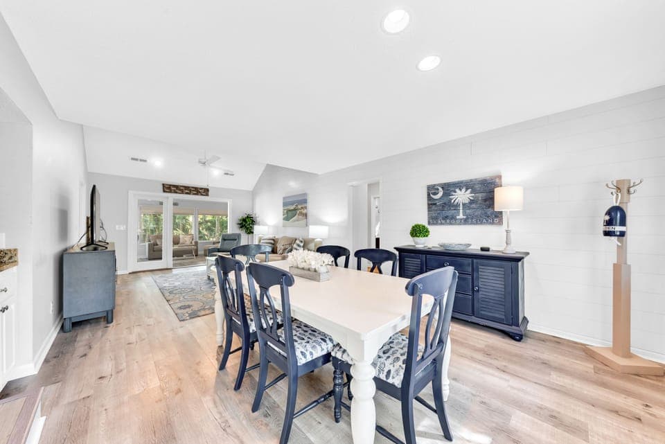 A large farm table seats six