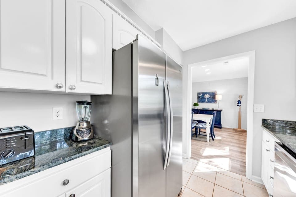 Large French door refrigerator and tile floors