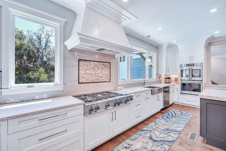 Fully stocked kitchen with stainless steel appliances.