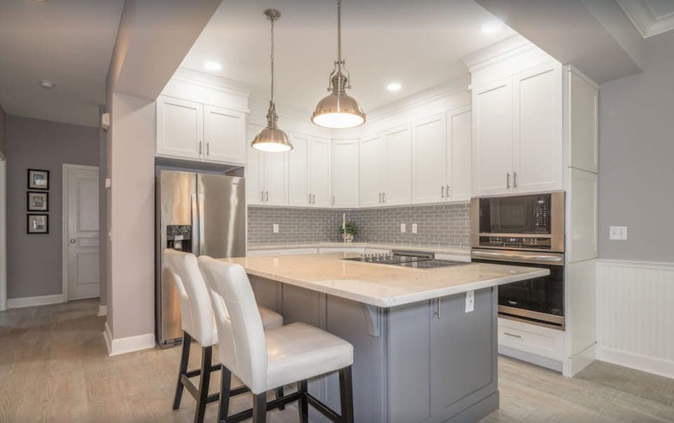 Large quartz island and countertops, Jenn Air cooktop. Great for the chefs!