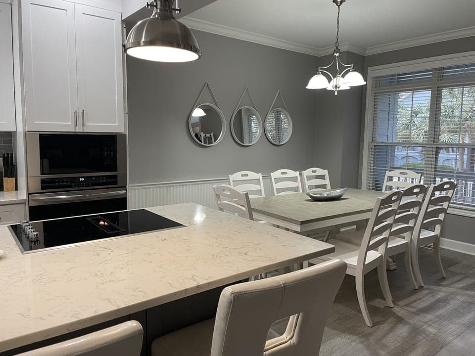 Kitchen island seats 2, kitchen table seats 8.