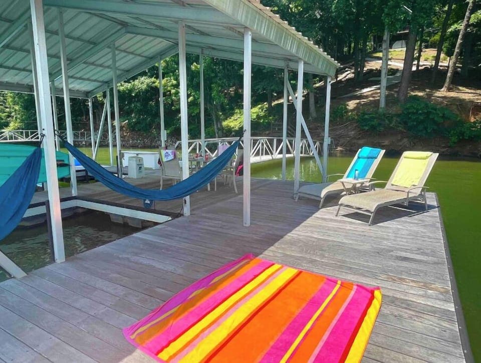 Spacious dock with room to spread out in the sun or under cover.  Swim-up bench!