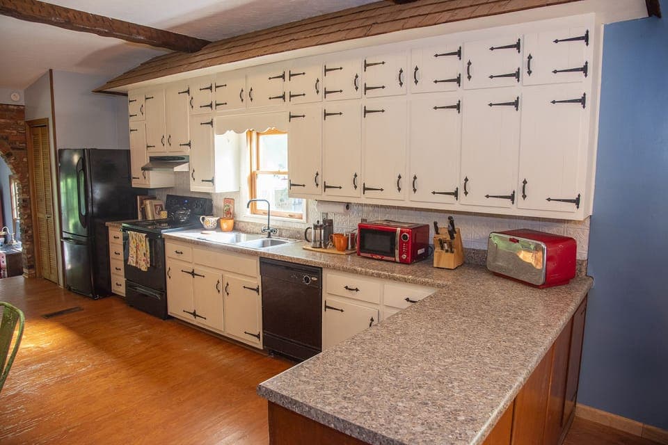 Kitchen with lots of counter space and storage. 