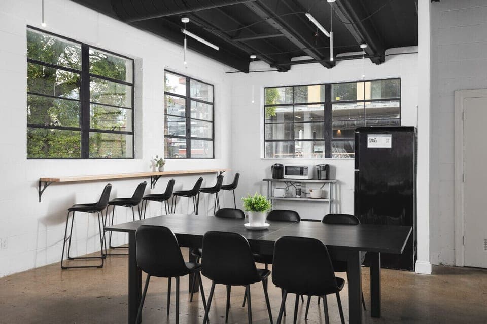 Seating for 6 at the dining table, plus 6 barstools along the kitchen's coffee bar.