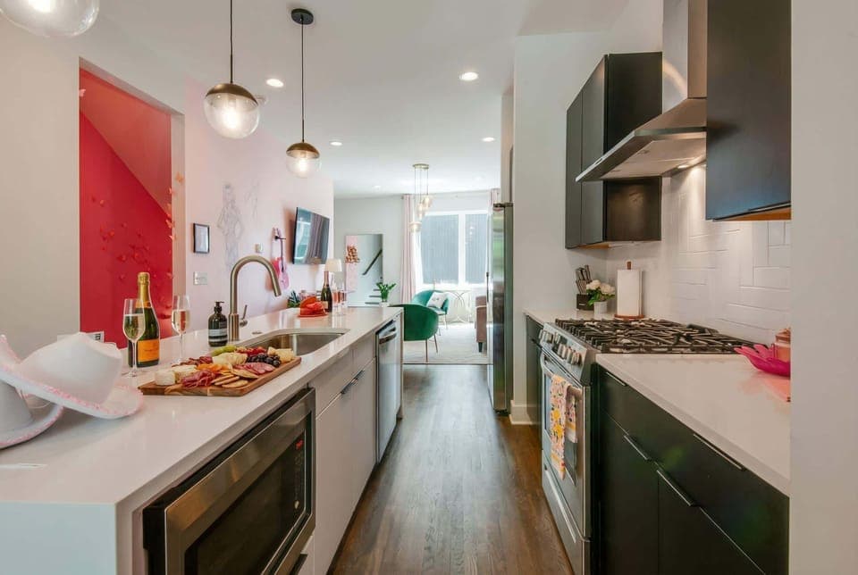 Welcome to your luxury Nashville escape! This chic kitchen is perfect for brunch with friends or planning adventures. With stylish decor and an open layout, it's ideal for large groups celebrating a bachelorette party or a sophisticated getaway. Make lasting memories in Music City!