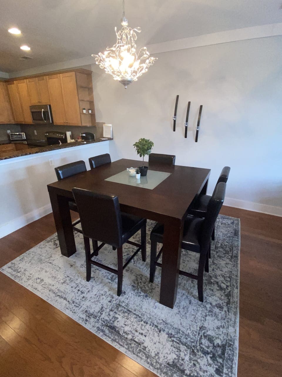 The oversized dining table has six chairs and a bench seat.