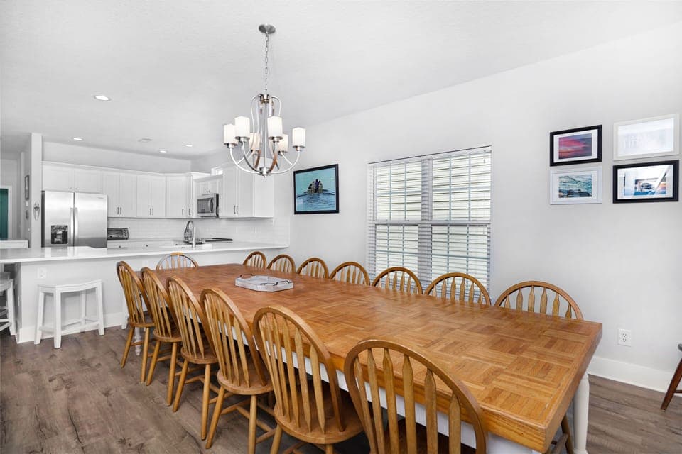 Gather around your spacious dining table for memorable meals, with the fully equipped kitchen just steps away for easy entertaining.