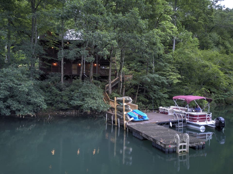 Private Dock with Pontoon Boat, kayaks, and swimming platform