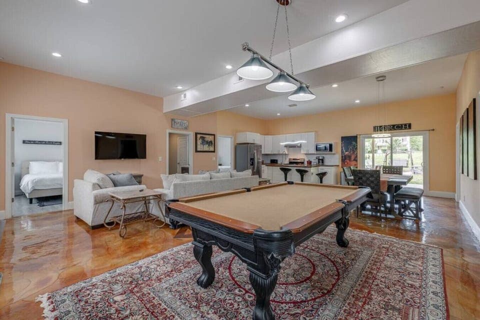 Open concept living area with pool table
