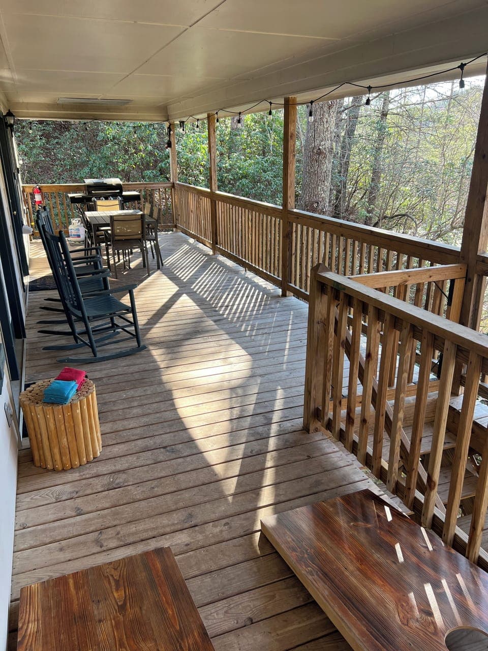 Enjoy the treetop breezes while you laugh together and play cornhole!