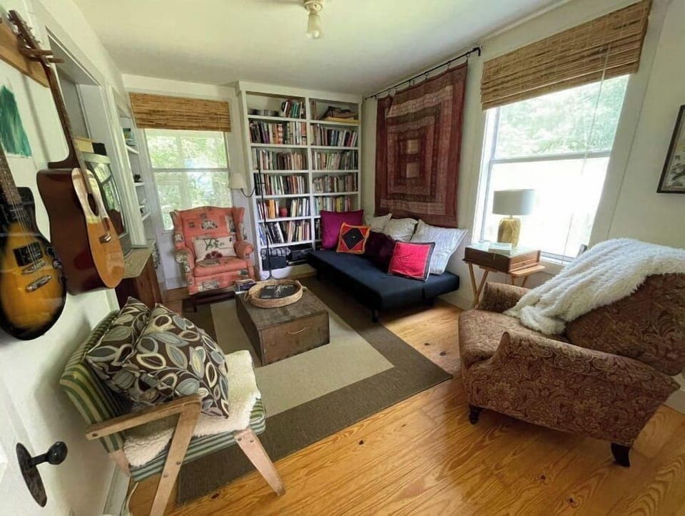 cozy den with TV and lay flat couch for sleeping