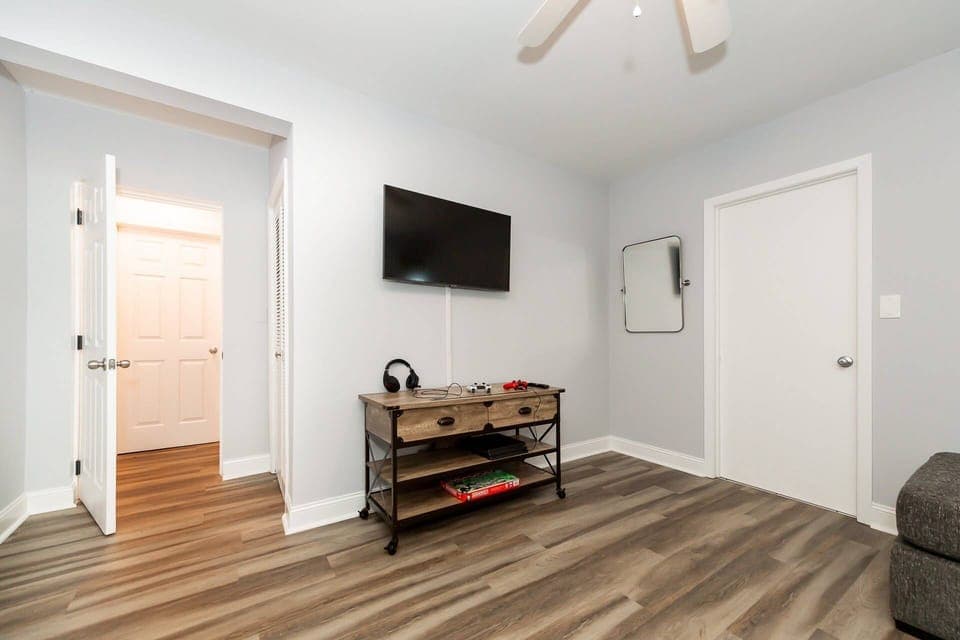 The downstairs area offers a large TV and a Play Station 4 with preloaded games and headphones