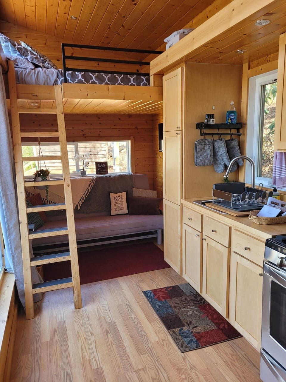 Queen bunk over a living room area with a queen futon, if needed.