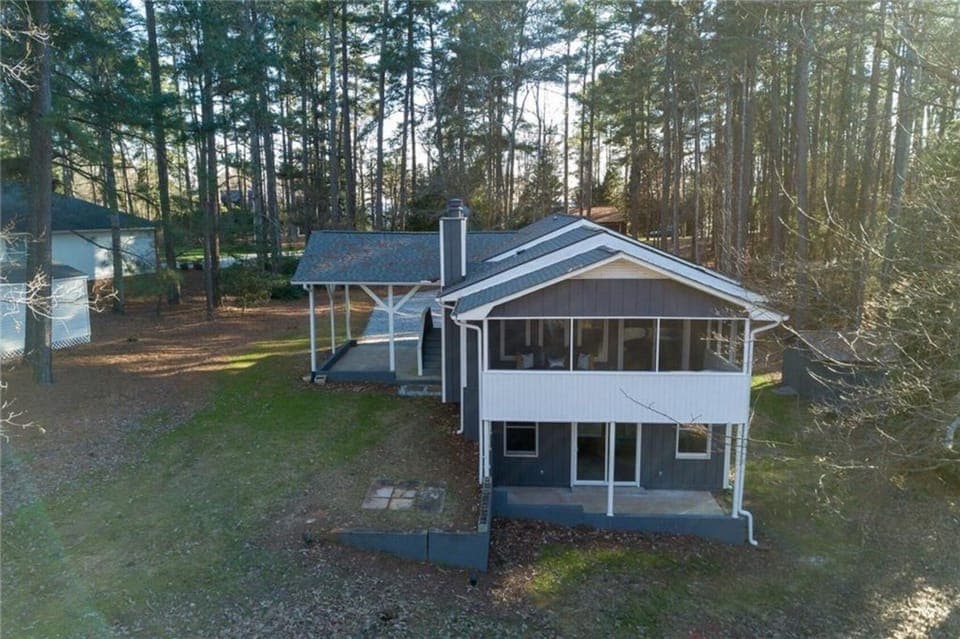 Carport, screened in porch, and covered patio