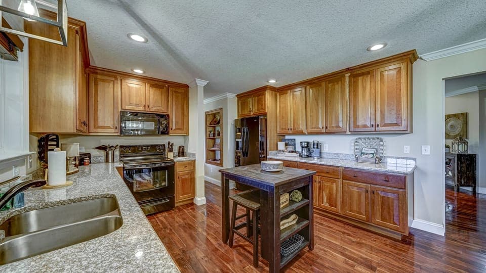 2 can sit on the stools at the island in the main level kitchen