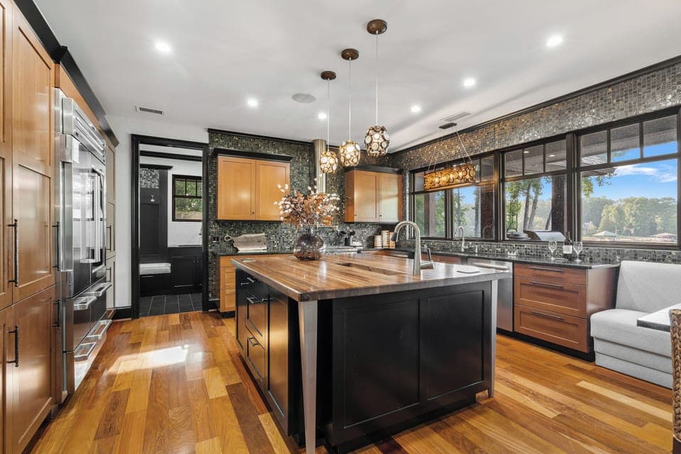 Large kitchen with island, two dishwashers & side by side fridge & freezer.
