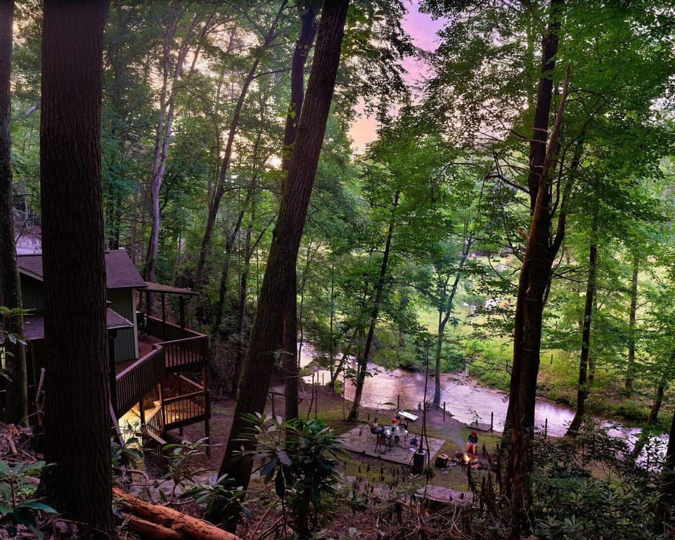 Sunset view from steps to soaking hot tub and rock formation