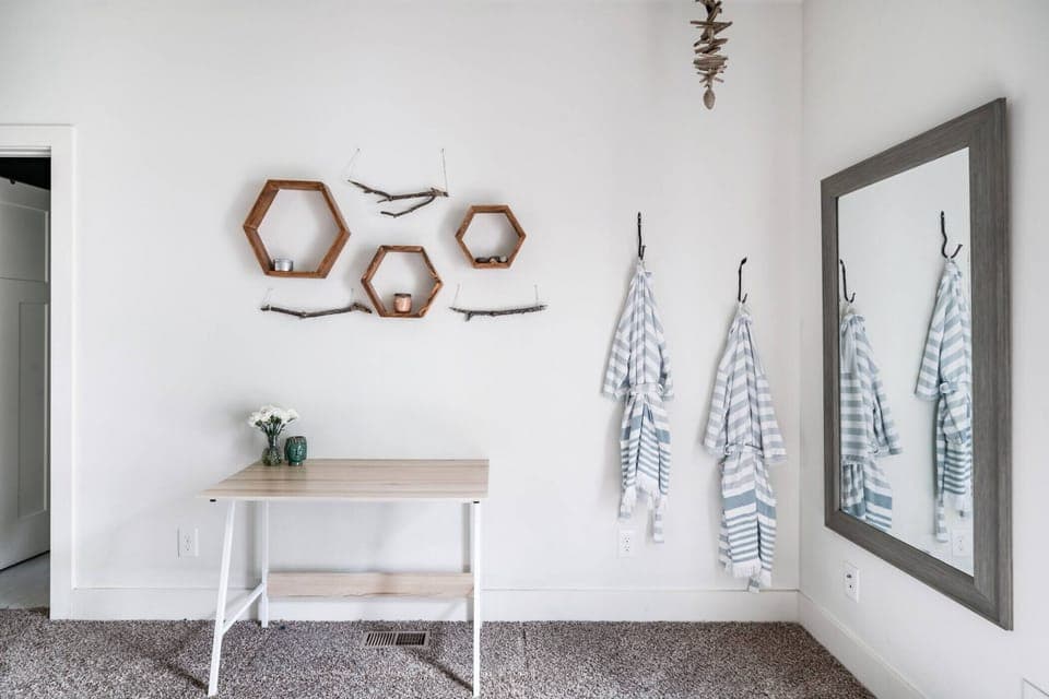 Cozy nook area with a full size mirror.