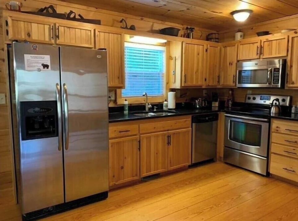 Fully equipped kitchen with stainless steel appliances and granite countertops