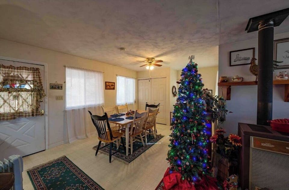 Dining area with a Christmas tree for the holidays. 