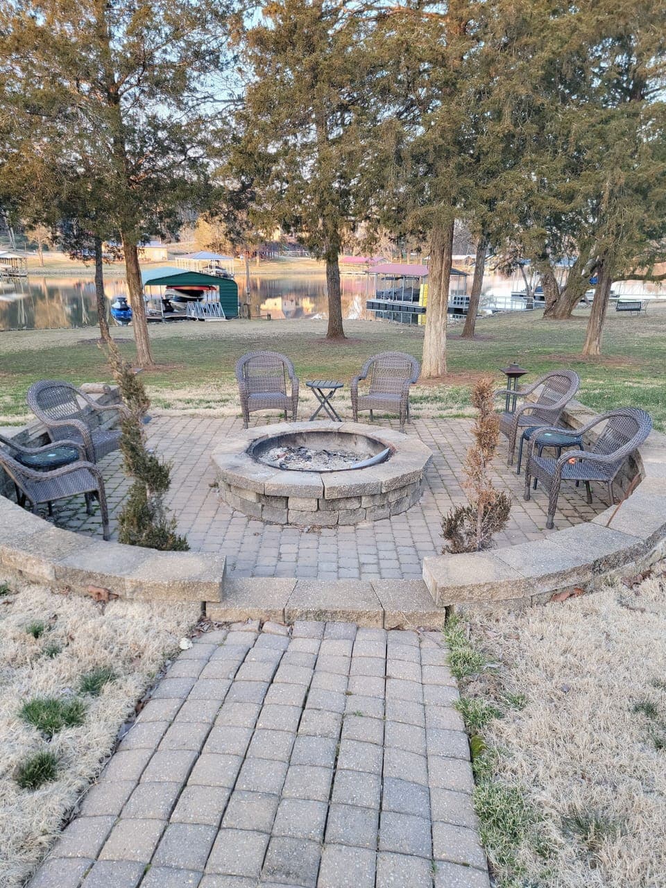 Large firepit area with seating and tables.  