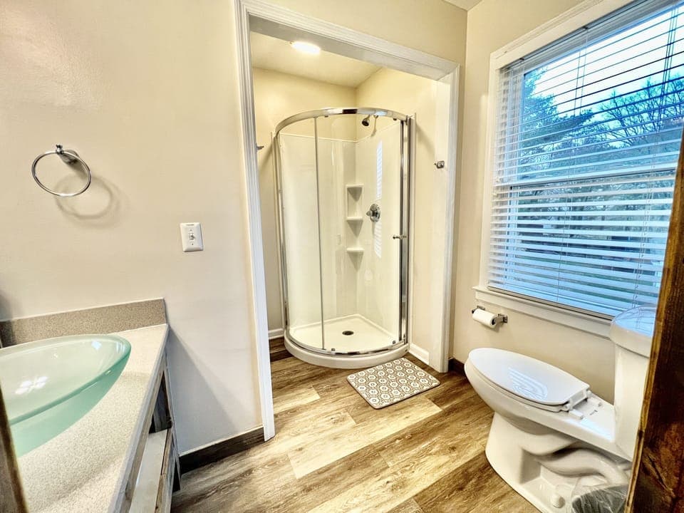 Pamper yourself in the inviting bathroom with a modern shower cabin.
