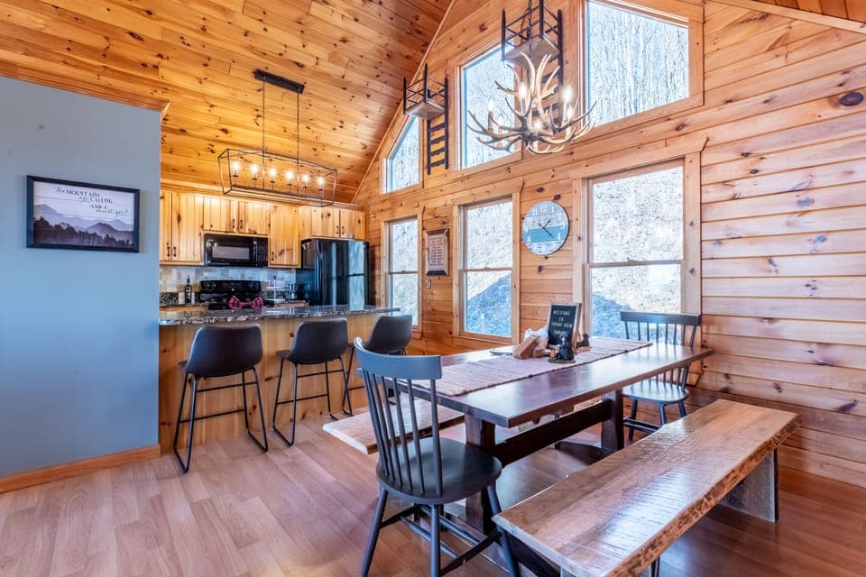 Spacious dining area with live-edge benches and seating for up to 12 guests.