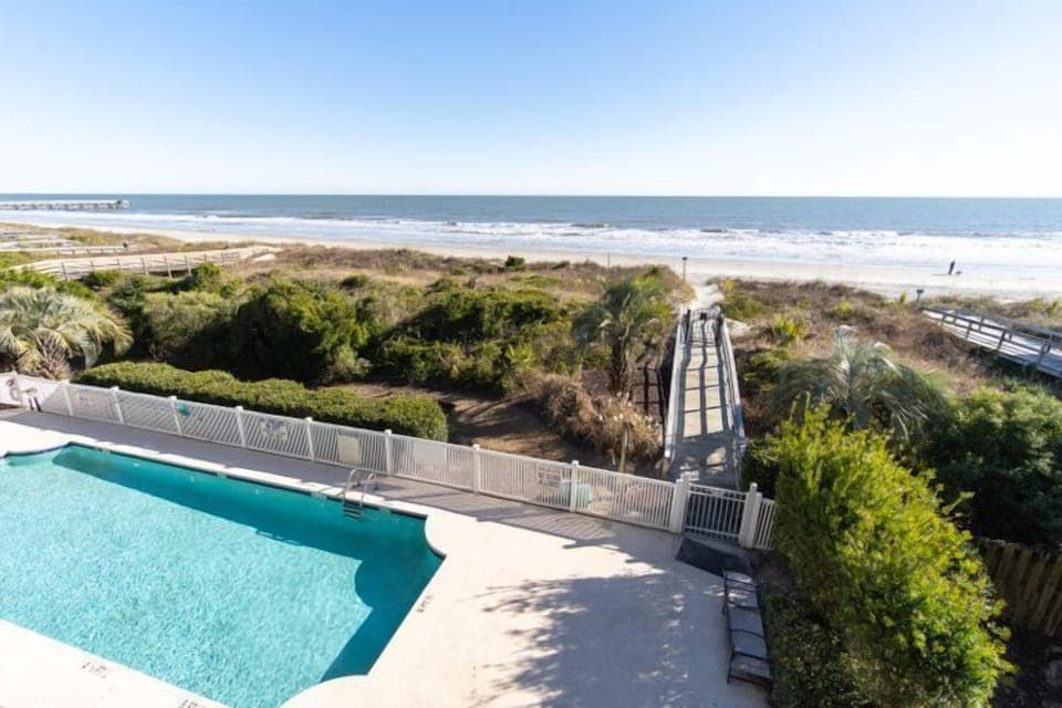 Our community pool meets the endless horizon of the oceanfront.