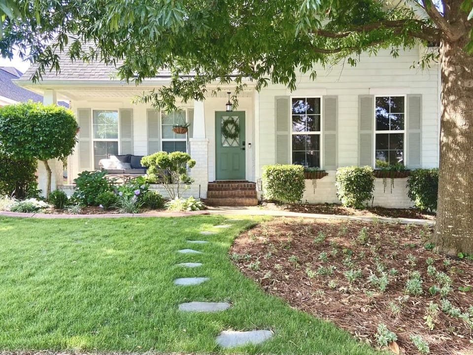 Stepping stones and window planters lend to a very cottage-like feel. 