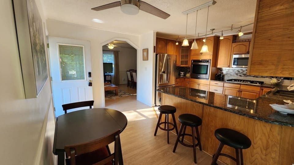 Eat-in bar and table in kitchen.