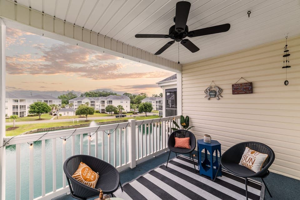 Beautiful porch overlooking koi pond. Outdoor fan, seating and, views for days
