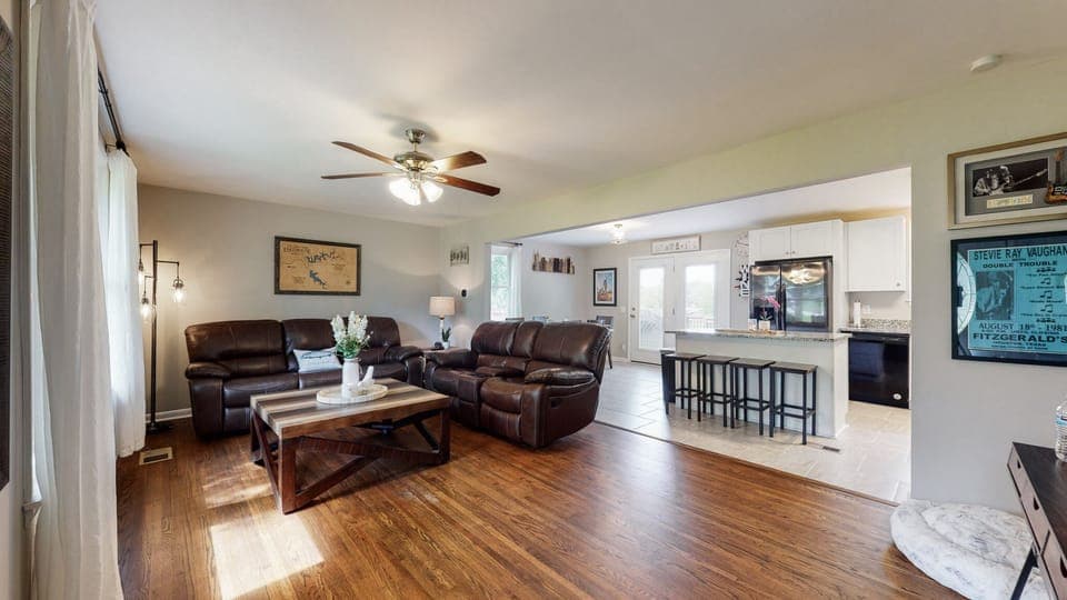 Relax on the recliners enjoying the 65in TV.  Great entertaining area.