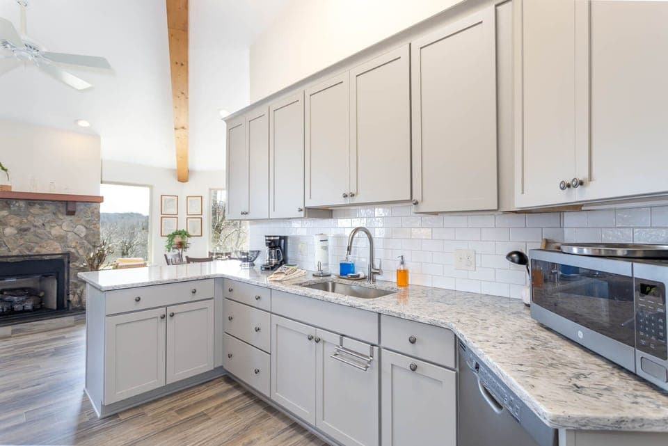 Plenty of Counter Space with Gas Log Fireplace Beyond the Kitchen